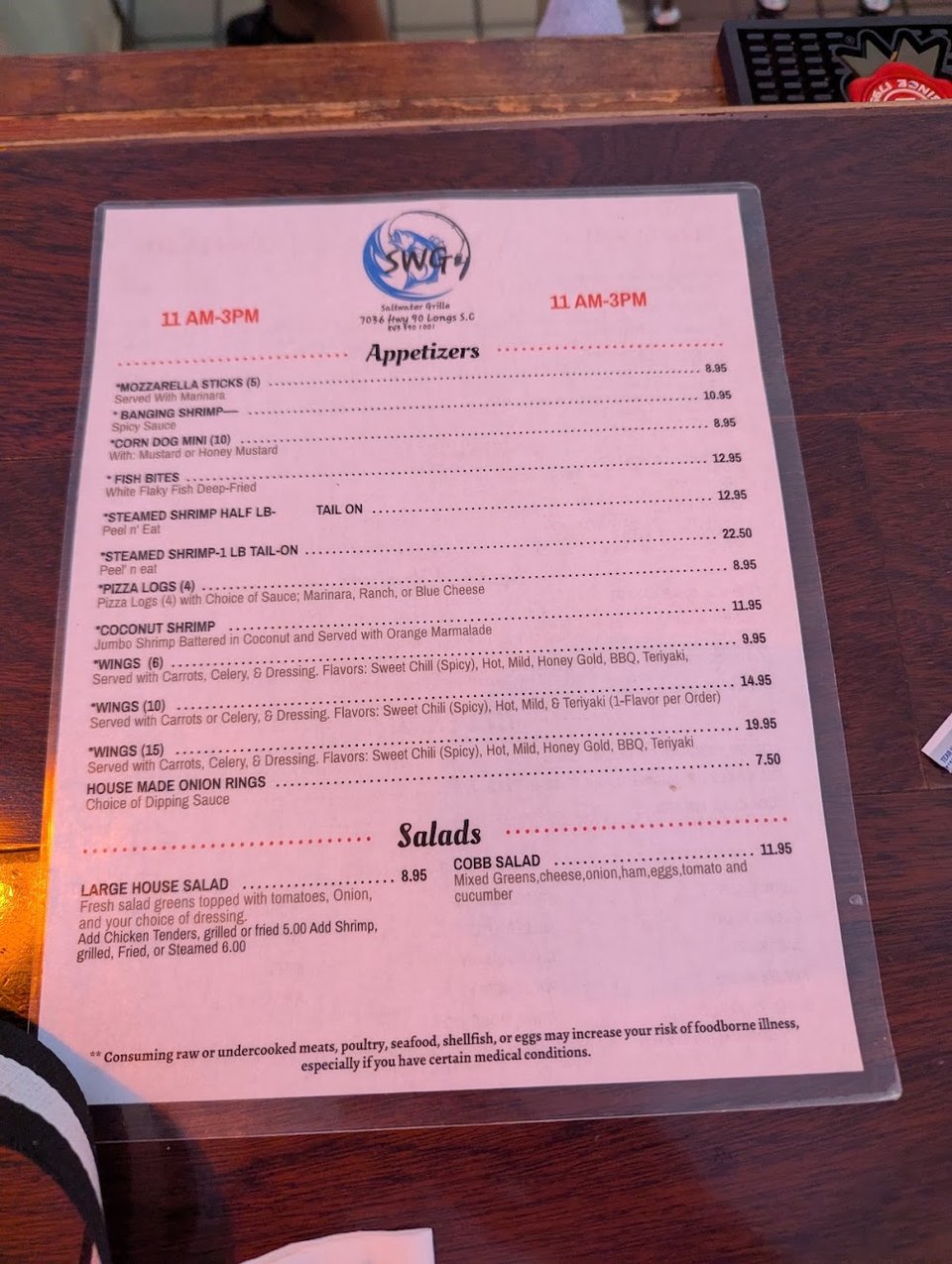 Printed menu showing salads, appetizers, and baskets.